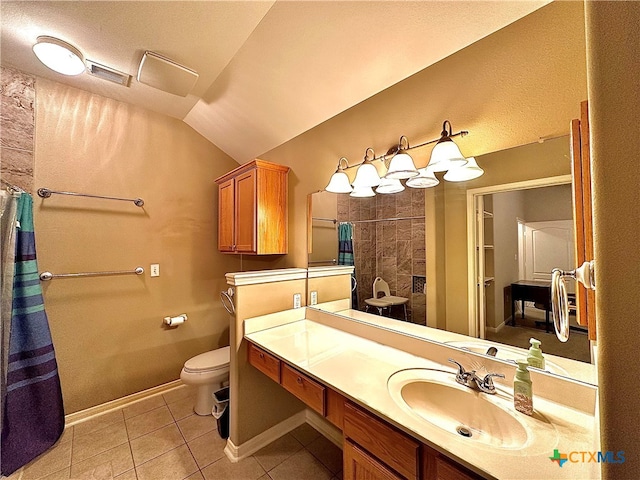 bathroom with toilet, tile patterned floors, vaulted ceiling, a textured ceiling, and vanity