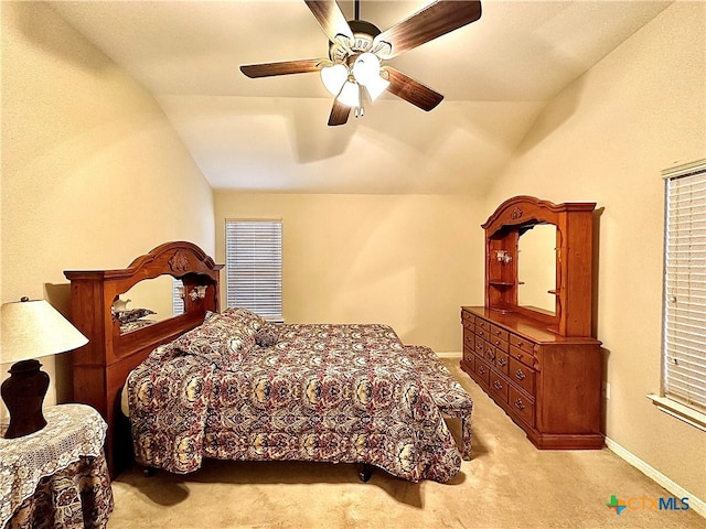 carpeted bedroom with lofted ceiling and ceiling fan