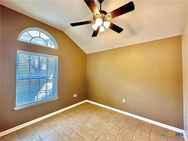 tiled spare room with lofted ceiling and ceiling fan