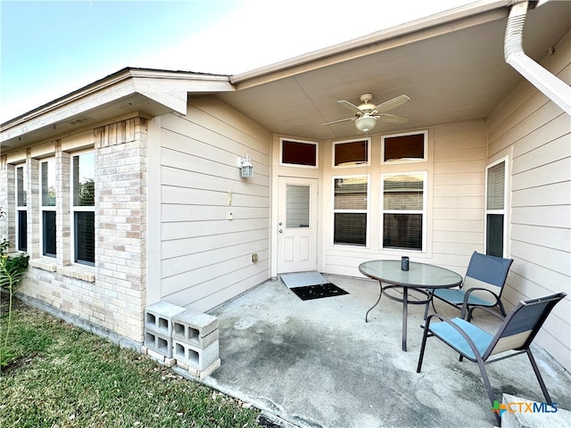 view of patio featuring ceiling fan