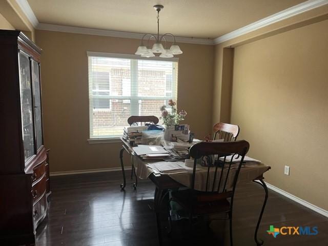 2107 Golden Eagle Dr, Killeen, TX 76549 - dining room featuring an inviting chandelier, baseboards, ornamental molding, and dark wood finished floors