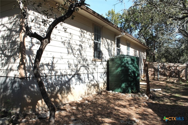 view of side of home with a storage unit