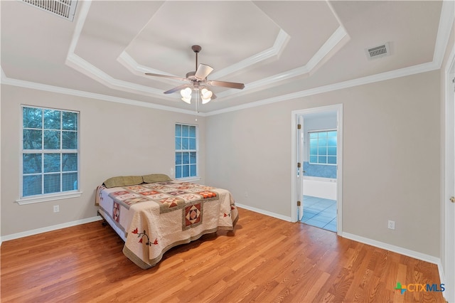 bedroom featuring connected bathroom, ceiling fan, ornamental molding, and light wood-type flooring