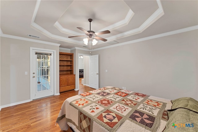 bedroom featuring access to exterior, ceiling fan, hardwood / wood-style floors, and crown molding