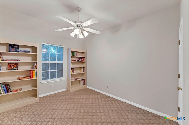 interior space with light colored carpet and ceiling fan