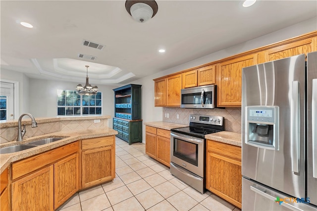 tiled dining area with a tray ceiling, crown molding, and an inviting chandelier