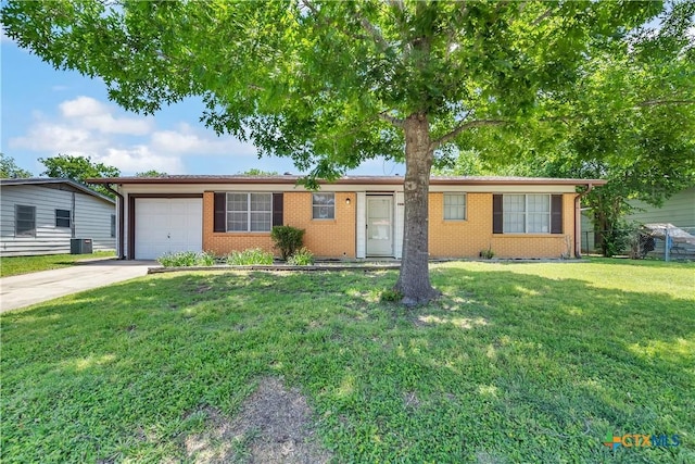1210 Ridgemont Dr, Killeen, TX 76549 - single story home featuring driveway, an attached garage, a front lawn, brick siding, and central AC unit
