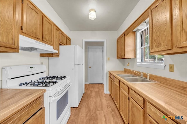 1210 Ridgemont Dr, Killeen, TX 76549 - kitchen with white range with gas stovetop, under cabinet range hood, a sink, light countertops, and light wood-type flooring