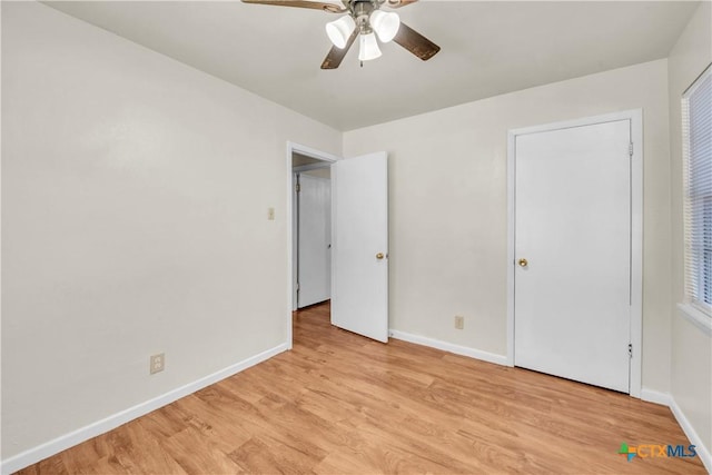 1210 Ridgemont Dr, Killeen, TX 76549 - unfurnished bedroom featuring baseboards, light wood-style floors, and a ceiling fan