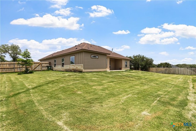 117 Aidan Ct, Burnet, TX 78611 - back of house with board and batten siding and stone siding
