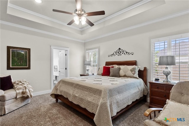 117 Aidan Ct, Burnet, TX 78611 - carpeted bedroom with a raised ceiling, crown molding, baseboards, ensuite bathroom, and a ceiling fan