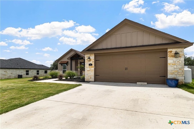 117 Aidan Ct, Burnet, TX 78611 - view of front of property with stone siding, driveway, board and batten siding, and a garage