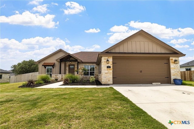 117 Aidan Ct, Burnet, TX 78611 - view of front of property featuring stone siding, board and batten siding, driveway, and a garage