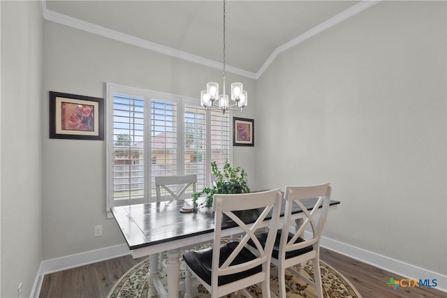 117 Aidan Ct, Burnet, TX 78611 - dining room featuring crown molding, vaulted ceiling, a chandelier, baseboards, and dark wood finished floors