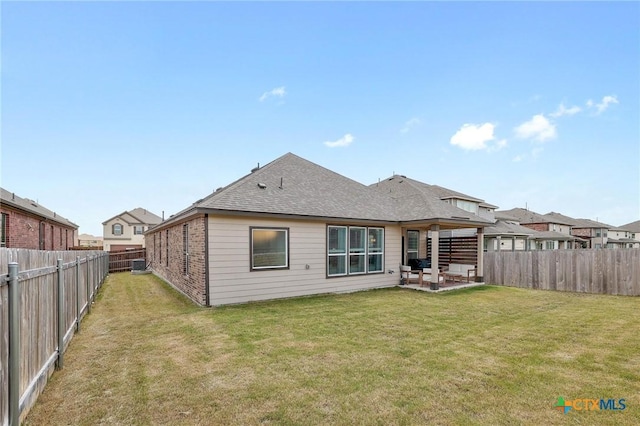 4648 Padula Dr, Round Rock, TX 78665 - rear view of house featuring a patio, a fenced backyard, and a shingled roof
