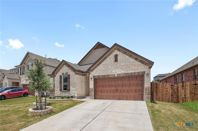 4648 Padula Dr, Round Rock, TX 78665 - french country style house featuring stone siding, a garage, and driveway