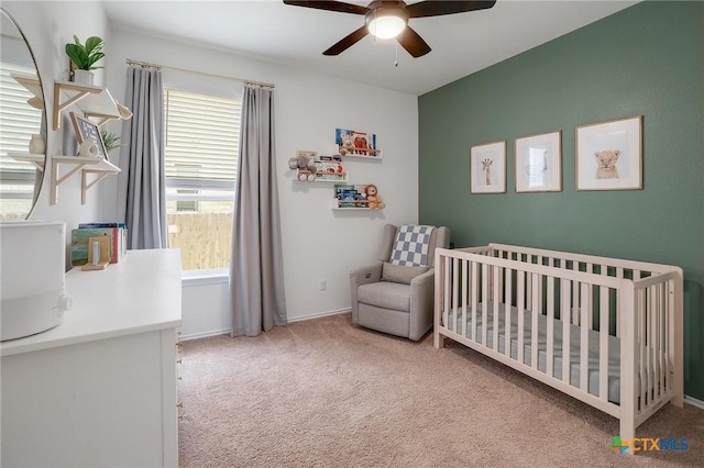 4648 Padula Dr, Round Rock, TX 78665 - carpeted bedroom featuring a crib and a ceiling fan