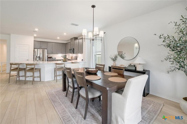 4648 Padula Dr, Round Rock, TX 78665 - dining space featuring a chandelier, light wood-type flooring, and recessed lighting