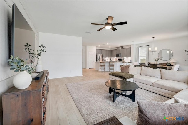 4648 Padula Dr, Round Rock, TX 78665 - living area with a ceiling fan, light wood finished floors, and recessed lighting
