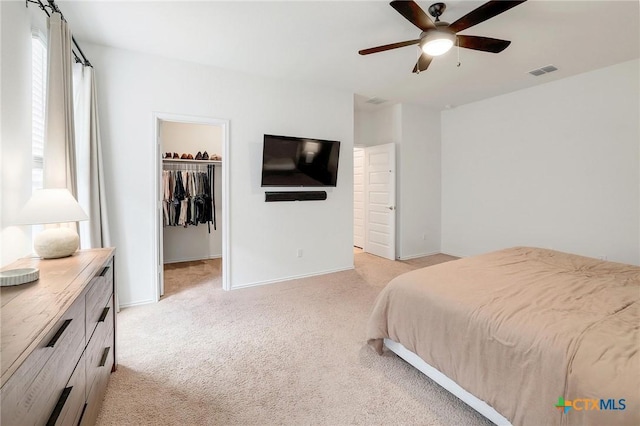 4648 Padula Dr, Round Rock, TX 78665 - bedroom with light carpet, a spacious closet, and ceiling fan