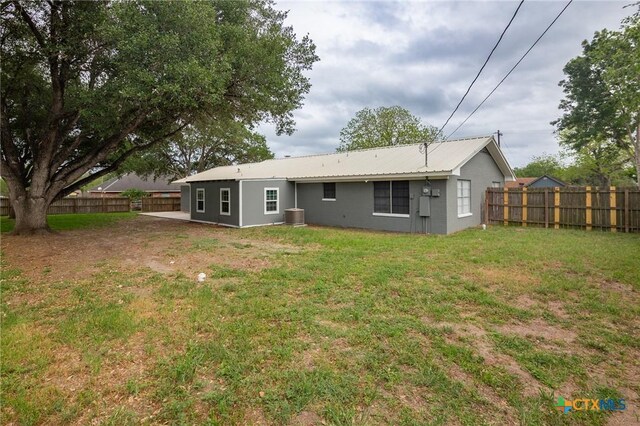 454 W Ward St, Goliad, TX 77963 - rear view of property with a fenced backyard and a metal roof