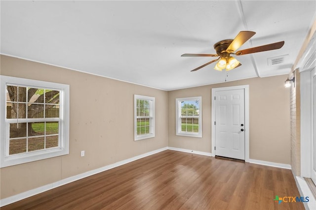 454 W Ward St, Goliad, TX 77963 - entrance foyer with wood finished floors and a ceiling fan