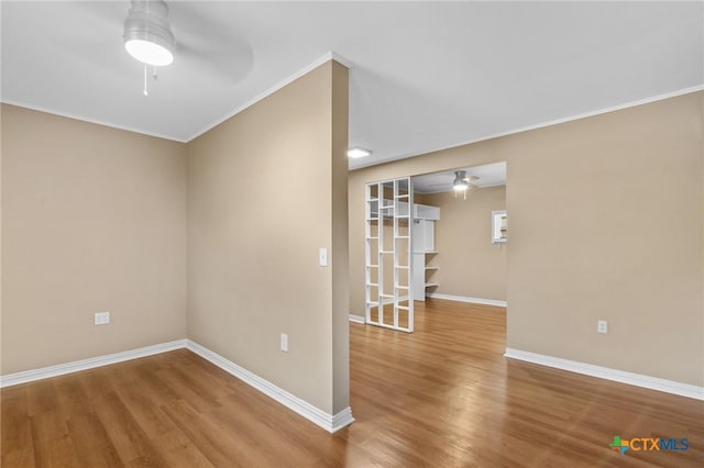 454 W Ward St, Goliad, TX 77963 - unfurnished room with a ceiling fan, wood finished floors, and ornamental molding