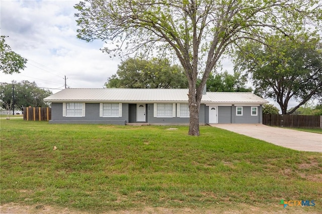 454 W Ward St, Goliad, TX 77963 - ranch-style house with a metal roof and driveway