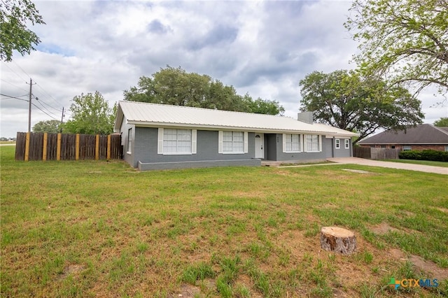 454 W Ward St, Goliad, TX 77963 - ranch-style house with a chimney and a metal roof
