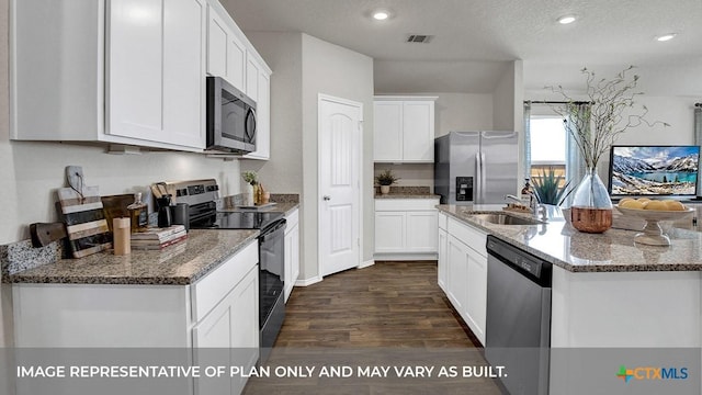 1000 Village Run, Seguin, TX 78155 - kitchen with appliances with stainless steel finishes, a kitchen island with sink, dark wood-style floors, white cabinets, and stone counters