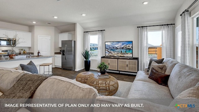 1000 Village Run, Seguin, TX 78155 - living area featuring dark wood-style flooring and recessed lighting