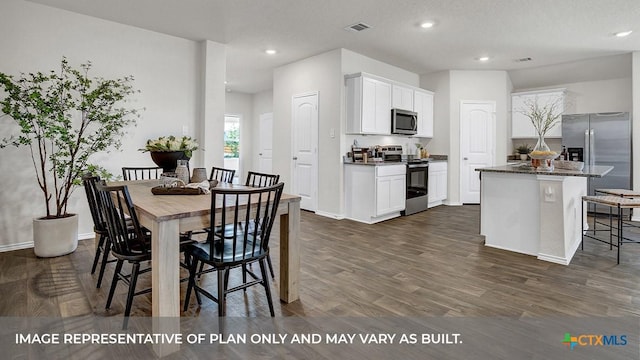 1000 Village Run, Seguin, TX 78155 - dining space with dark wood-style flooring and recessed lighting