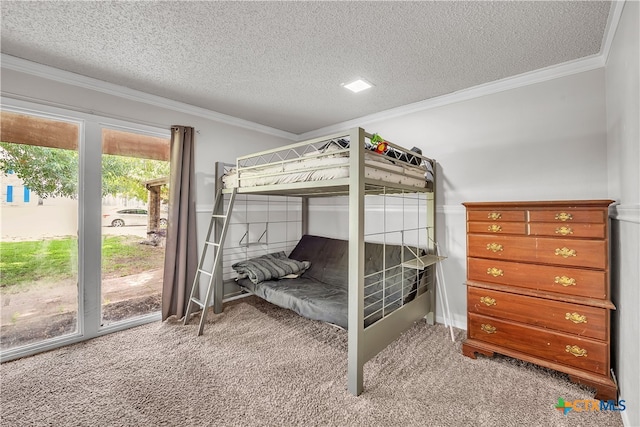 carpeted bedroom featuring access to exterior, a textured ceiling, and crown molding