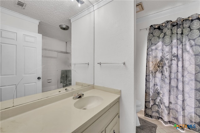 bathroom with crown molding, vanity, a textured ceiling, tile patterned flooring, and toilet