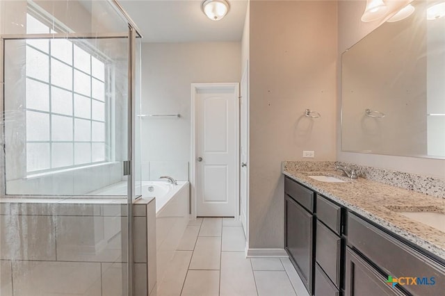 1233 Jester Ct, Copperas Cove, TX 76522 - bathroom featuring double vanity, a bath, tile patterned flooring, a shower stall, and a sink