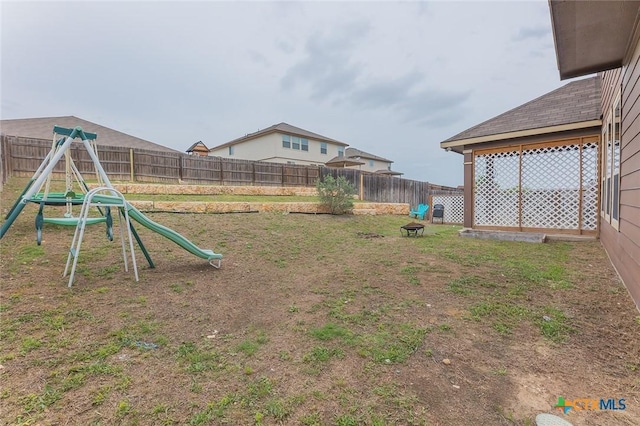 1233 Jester Ct, Copperas Cove, TX 76522 - view of yard featuring a fenced backyard and a playground