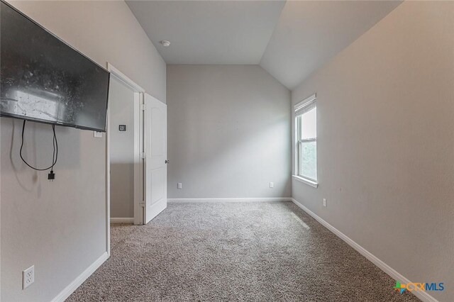 1233 Jester Ct, Copperas Cove, TX 76522 - empty room featuring carpet floors, baseboards, and vaulted ceiling