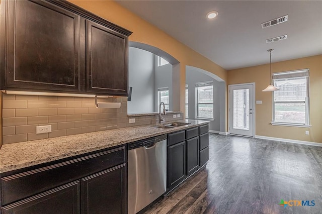 1233 Jester Ct, Copperas Cove, TX 76522 - kitchen with visible vents, dark wood-style floors, arched walkways, a sink, and dishwasher