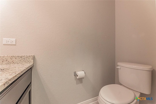 1233 Jester Ct, Copperas Cove, TX 76522 - bathroom with toilet, baseboards, and vanity