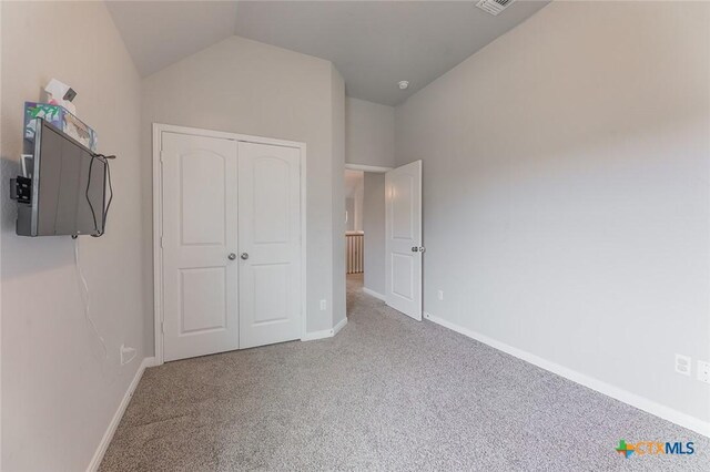 1233 Jester Ct, Copperas Cove, TX 76522 - unfurnished bedroom with visible vents, a closet, lofted ceiling, baseboards, and carpet flooring
