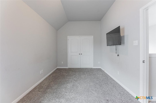 1233 Jester Ct, Copperas Cove, TX 76522 - unfurnished bedroom with baseboards, carpet, a closet, and lofted ceiling