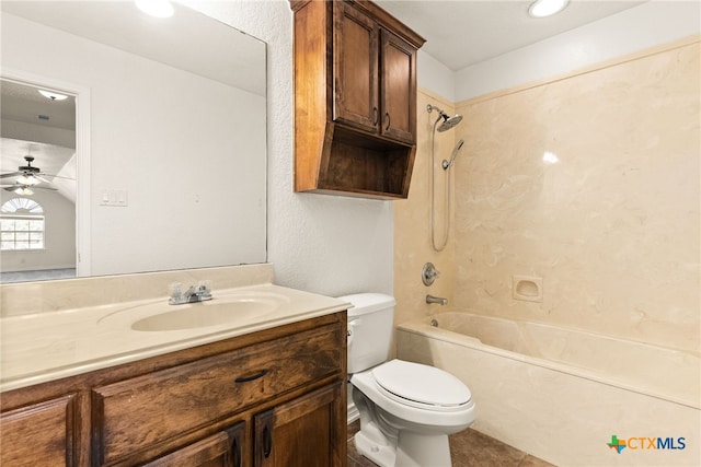 bathroom featuring vanity, shower / bathing tub combination, toilet, and a ceiling fan