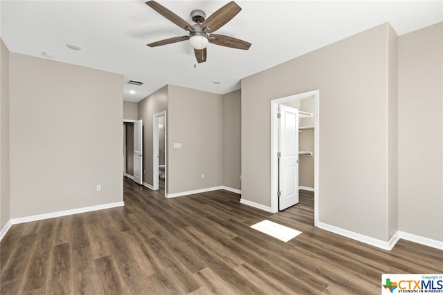 interior space featuring ceiling fan and dark hardwood / wood-style flooring