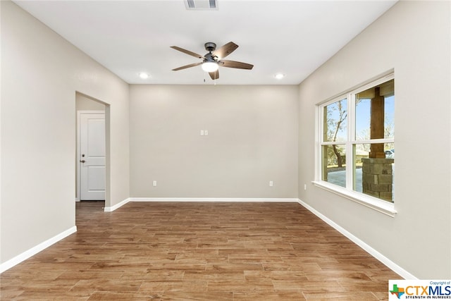 unfurnished room featuring light wood-type flooring and ceiling fan