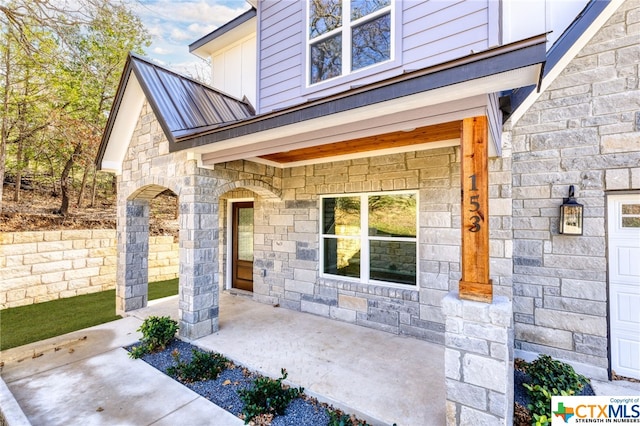 view of exterior entry featuring a garage