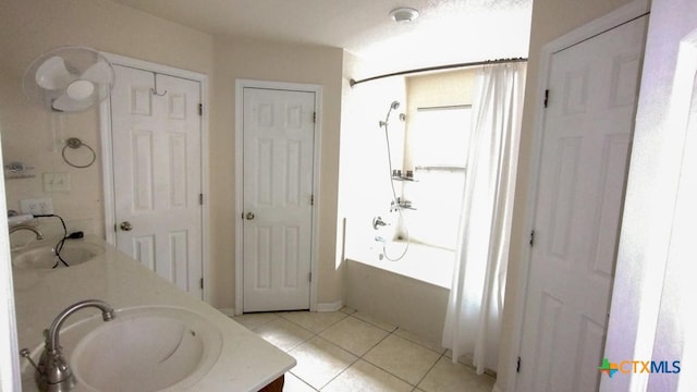 bathroom with vanity, tile patterned flooring, and shower / bathtub combination