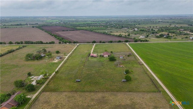 aerial view of sparsely populated area featuring extensive farmland