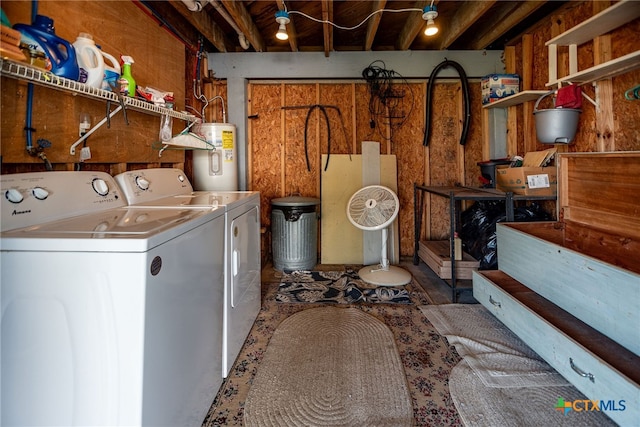 laundry area featuring electric water heater and separate washer and dryer