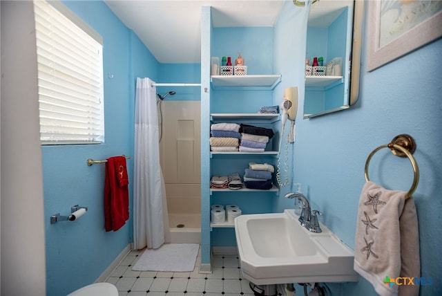 bathroom with sink and a shower with curtain