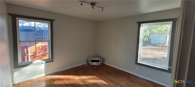 unfurnished room featuring hardwood / wood-style floors